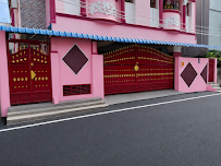 Chennai Stay PG entrance with pink walls and red gates