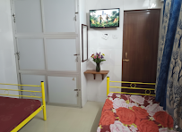 Owner photograph of a furnished bedroom with beds and storage